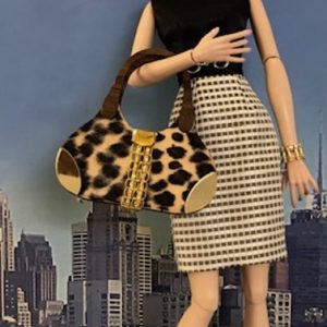 Architectural animal print with gold handbag
