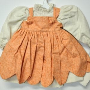 Dress w/Pinafore – Worsted dress w/ soft orange print scalloped