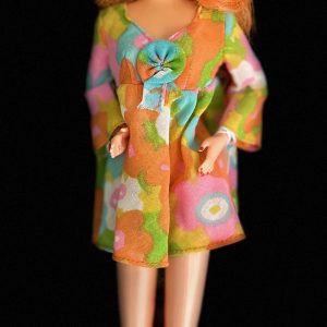 Barbie makeover by artist, Ann Miele.  Full re-root, vintage fashion, boots, jewelry; Repaint