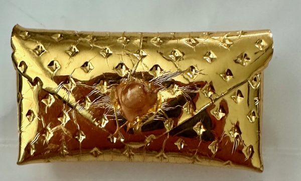 Vintage Barbie Gold Dimple clutch with button closure. mint